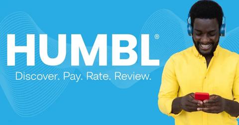 Humbl logo and a man looking on a smartphone