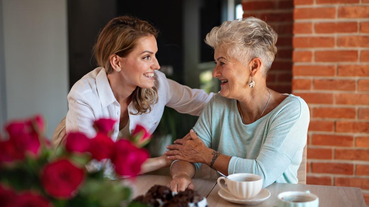 A mother and daughter discussing Mother's Day plans