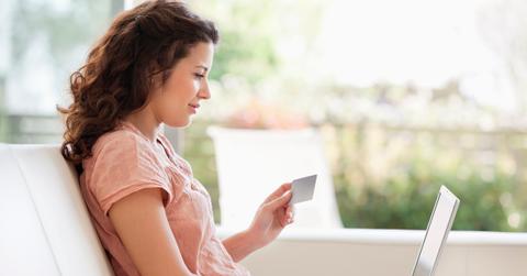 Person shopping online with credit card