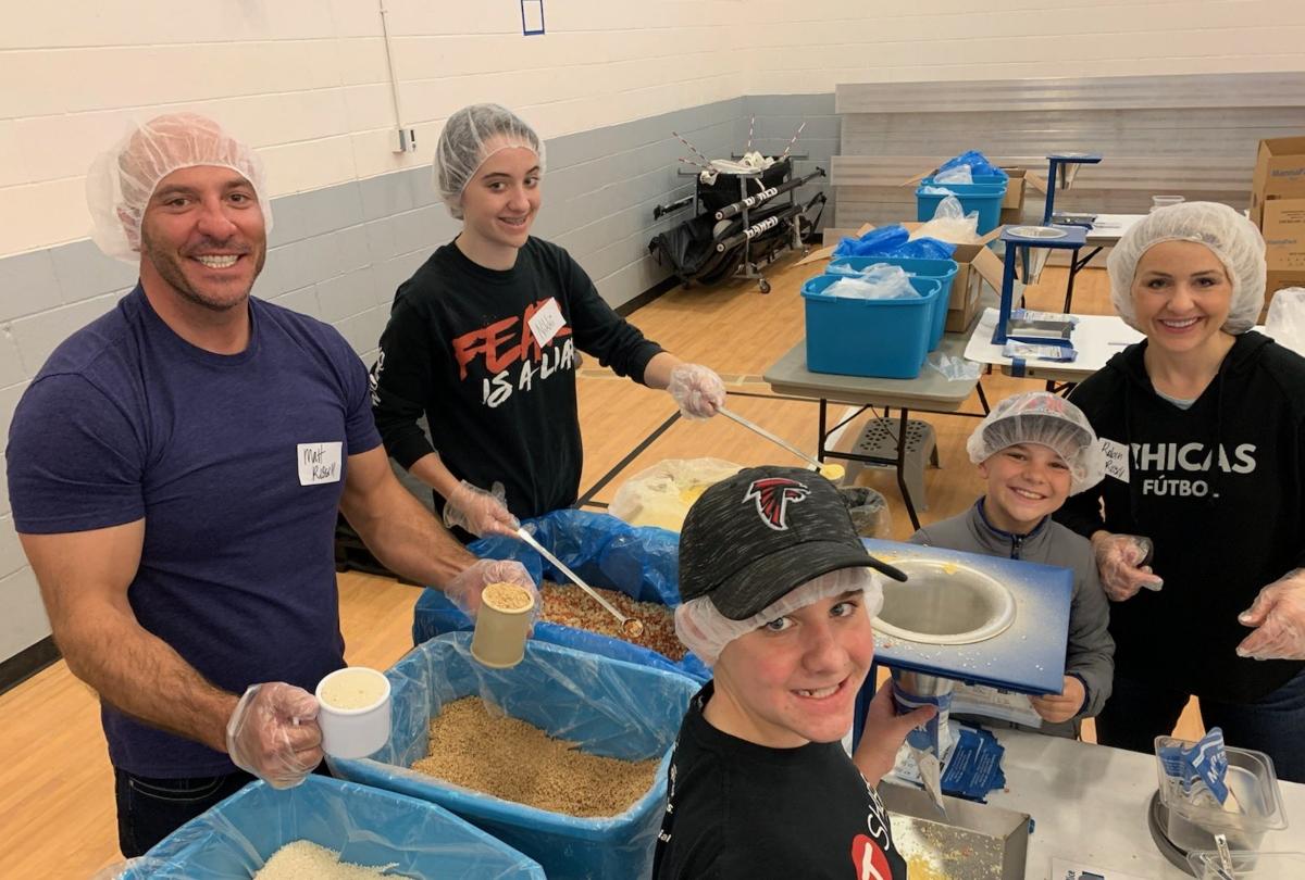 Matt Rissell and family at Feed My Starving Children