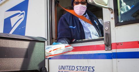 USPS worker delivery mail.