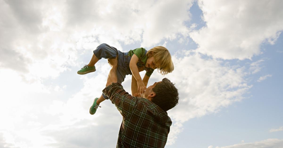 Father lifting son