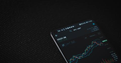 Black andriod smartphone displaying crypto price chart