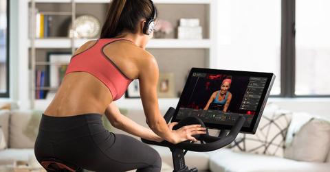 Woman exercising on a Peloton bike