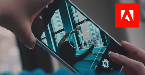 Adobe on a smartphone and Adobe logo