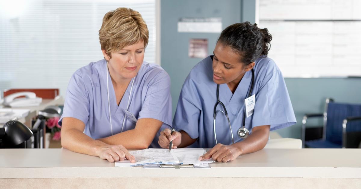 Nurses looking at PSLF waiver paperwork