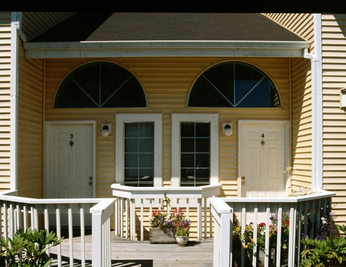 A yellow duplex entrances