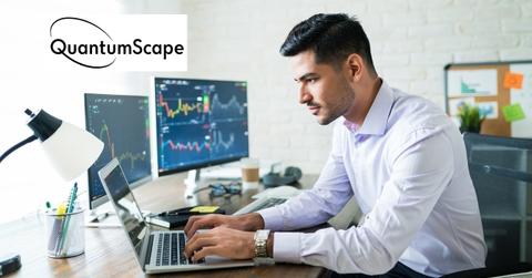 Man using a laptop and QuantumScape logo