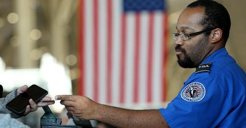 Airport worker checking an ID