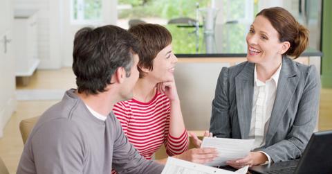 Couple with financial advisor discussing CD rates