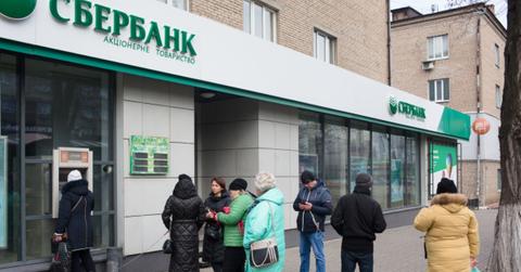 People lined up at a bank ATM in Ukraine amid the conflict with Russia.