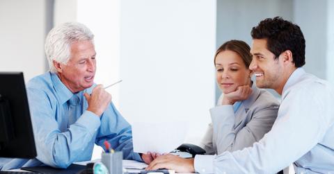 Financial planner helping a couple with their future investment