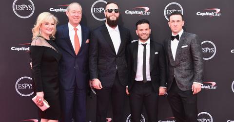 Jim Crane posing in a group at an event