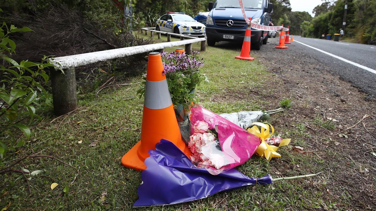 People left flowers by the woods where Grace Millane's body was found.