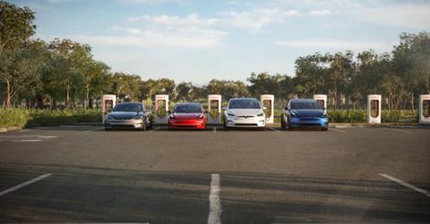 Tesla cars lined up charging
