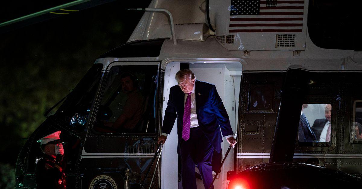 Trump exiting Marine One to return to the White House.