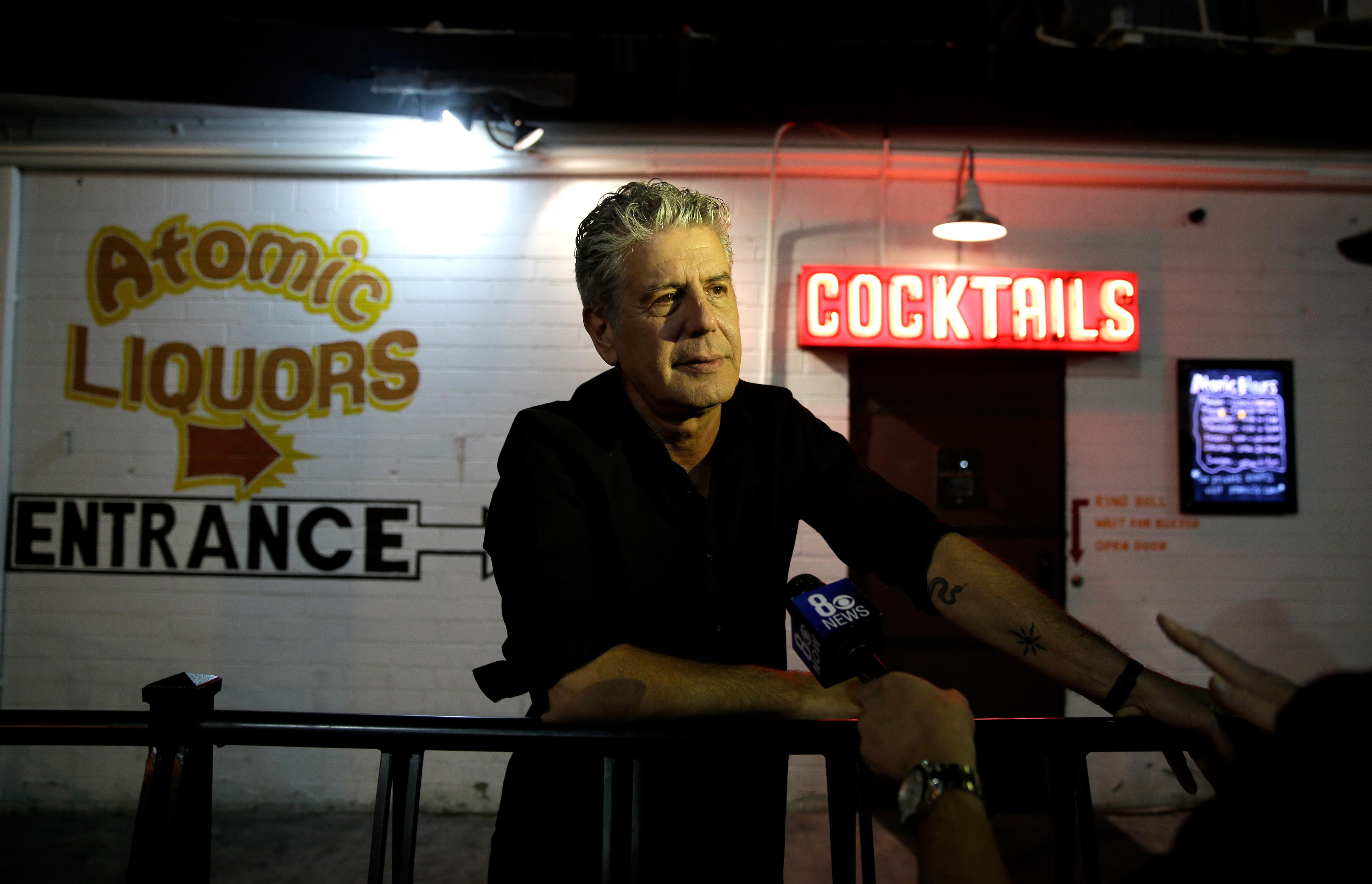 Anthony Bourdain outside of Atomic Liquors