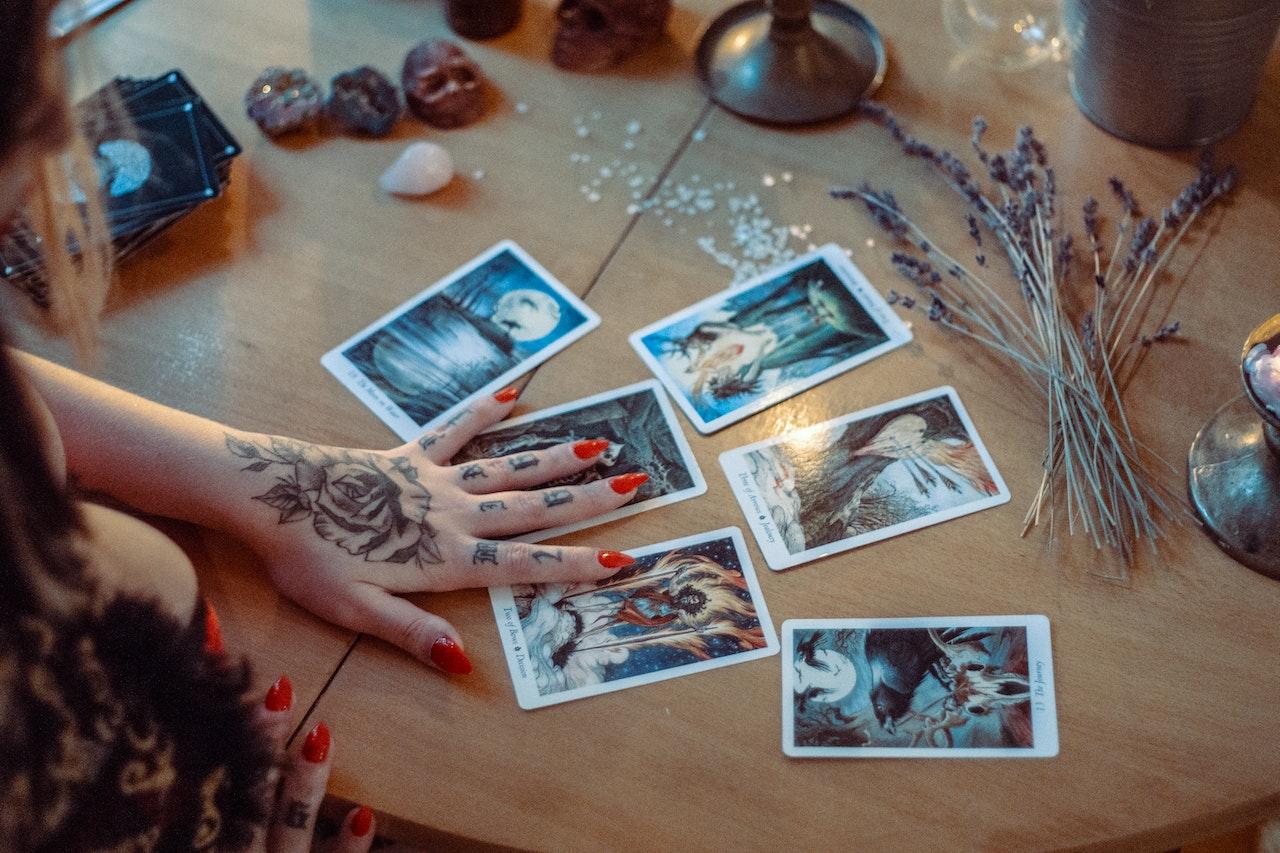 A tarot card reader looking at cards