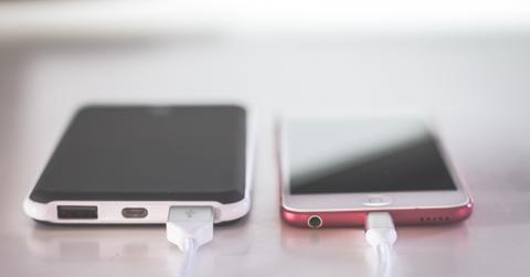 Two smartphones charging