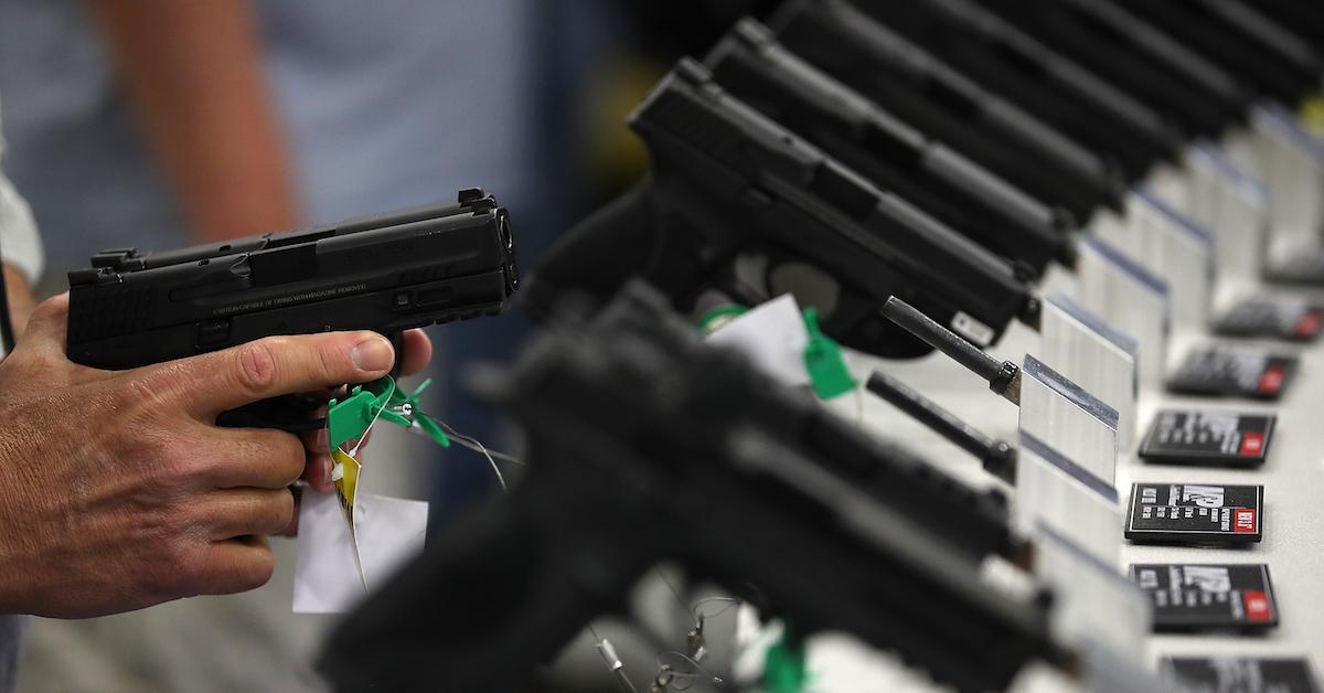 Man holding a Smith & Wesson gun