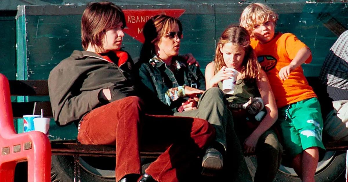 A young Benjamin Keough sitting beside his mother, sister, and his mother's ex-fiance in 2000.