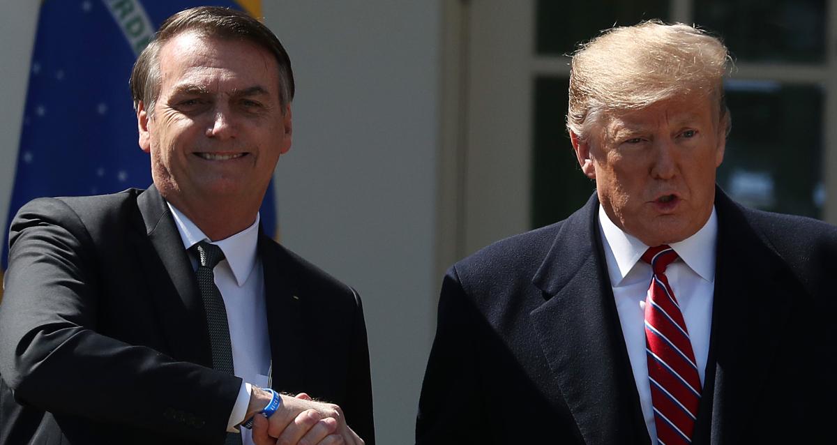 Jair Bolsonaro shaking hands with former president Donald Trump