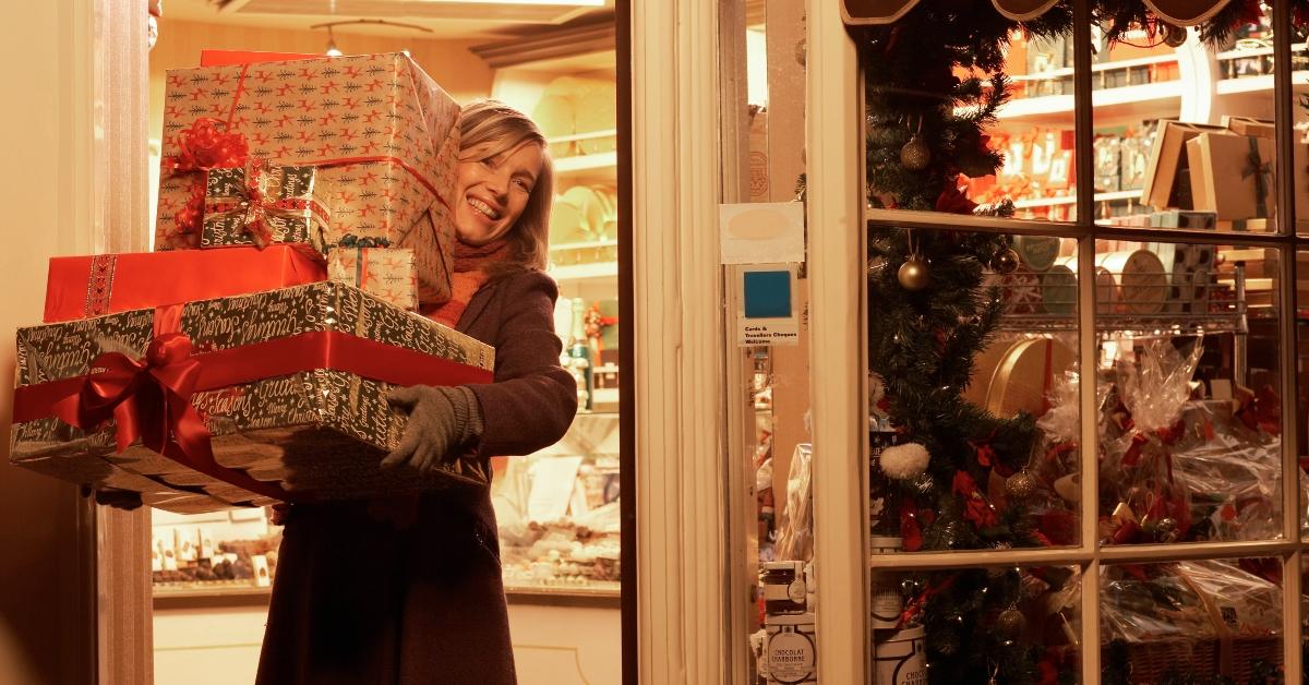 A woman carrying presents