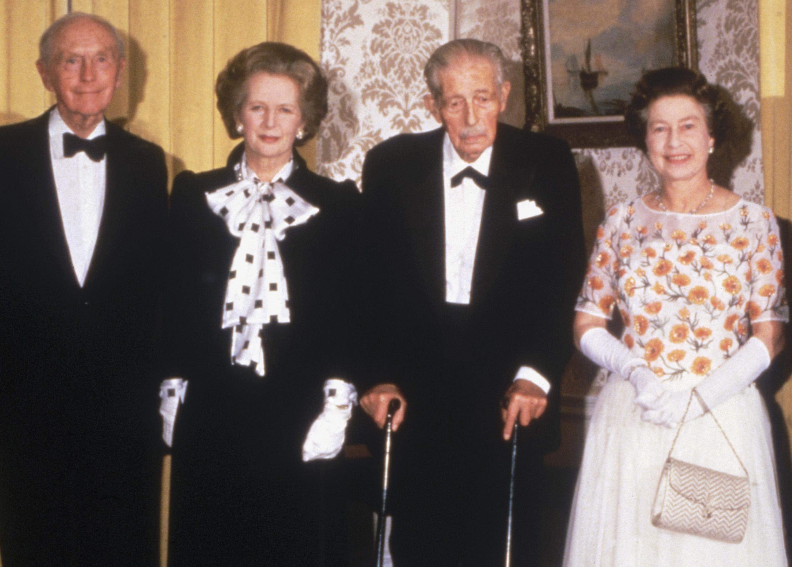 Home (L) standing with then PM Margaret Thatcher, former PM Harold Wilson, and Queen Elizabeth II