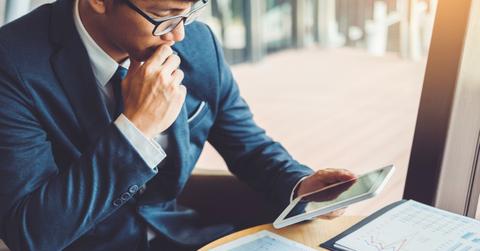 A man looking at economic data