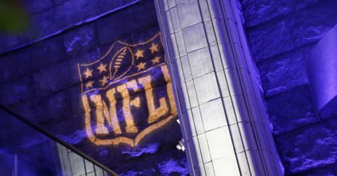 The NFL logo as a spotlight projected on a building