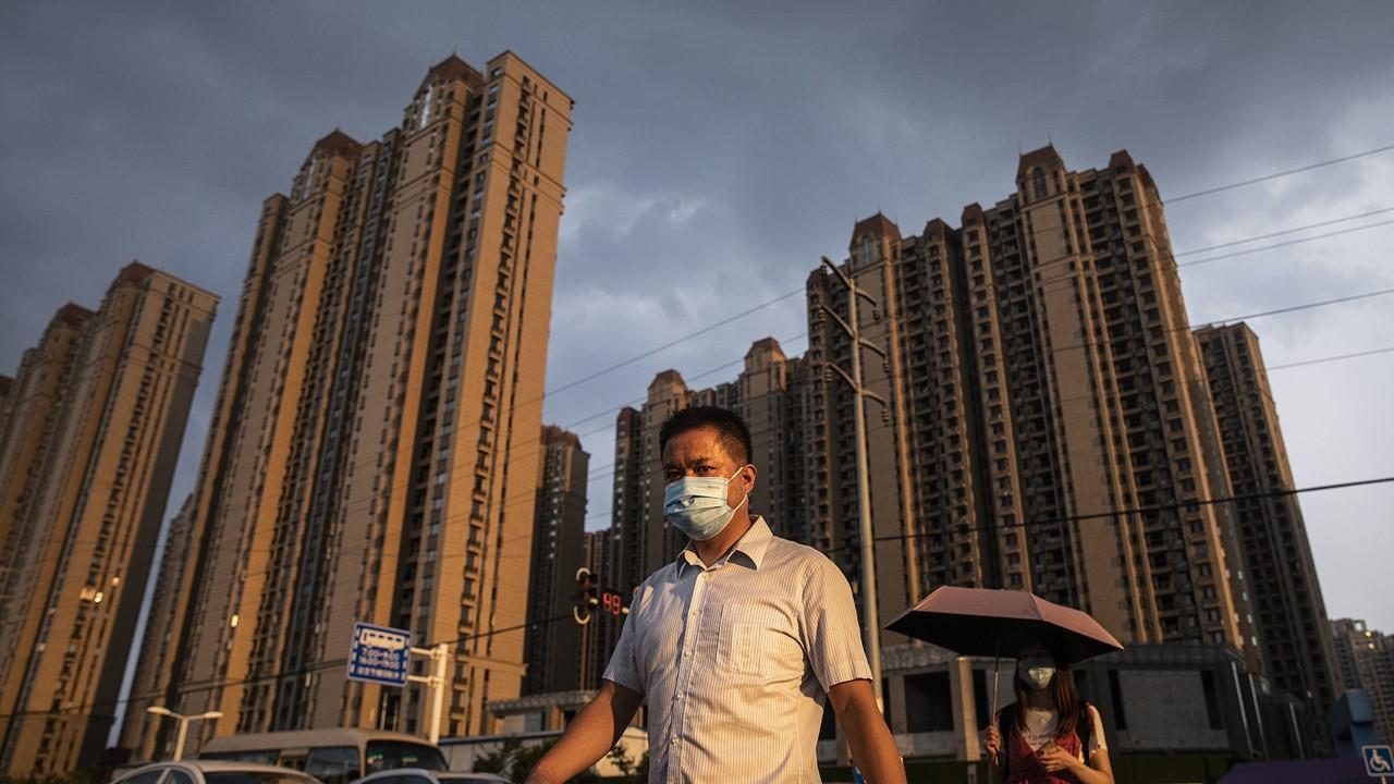 Man walking through the Evergrande Changqing community in Wuhan, China