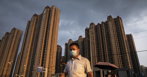 Man walking through the Evergrande Changqing community in Wuhan, China
