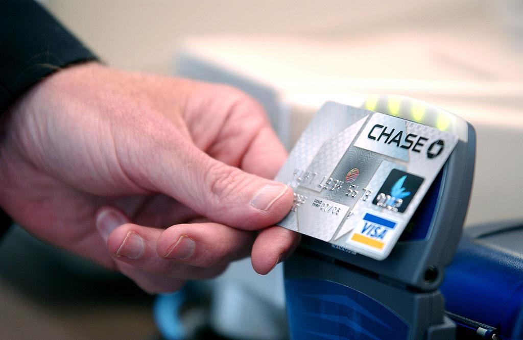 A person holding a Chase card