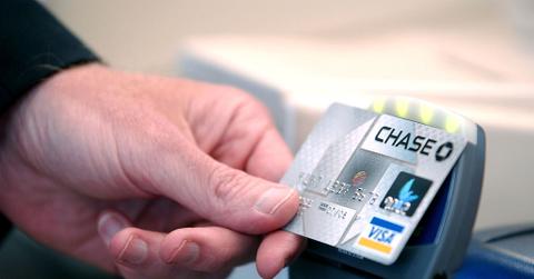A person holding a Chase card