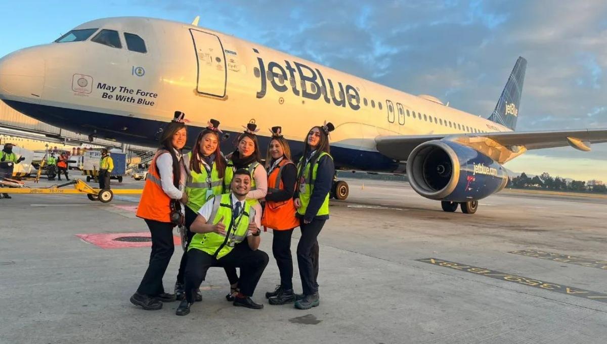 JetBlue flight crew in front of an airplane