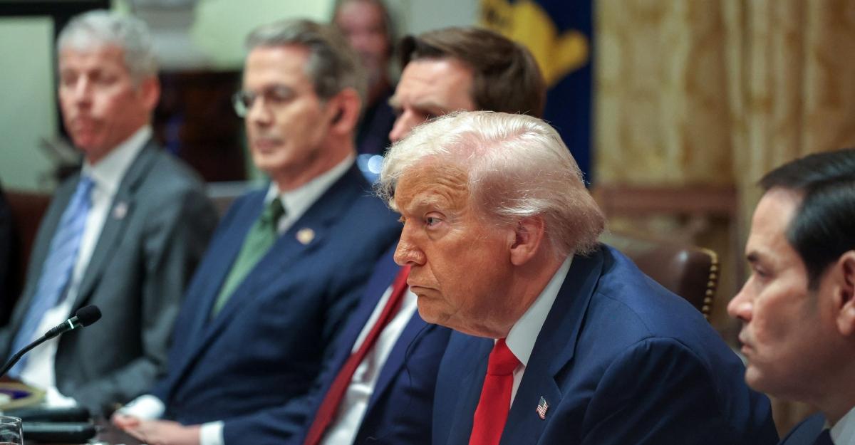 Trump looks serious during a meeting with the Argentinean president