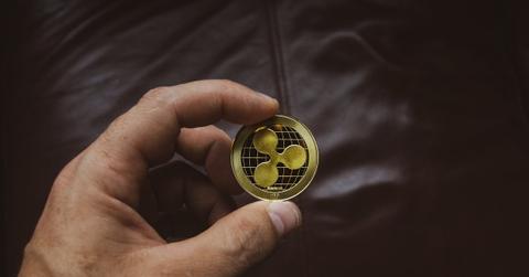 Person holding a Ripple token