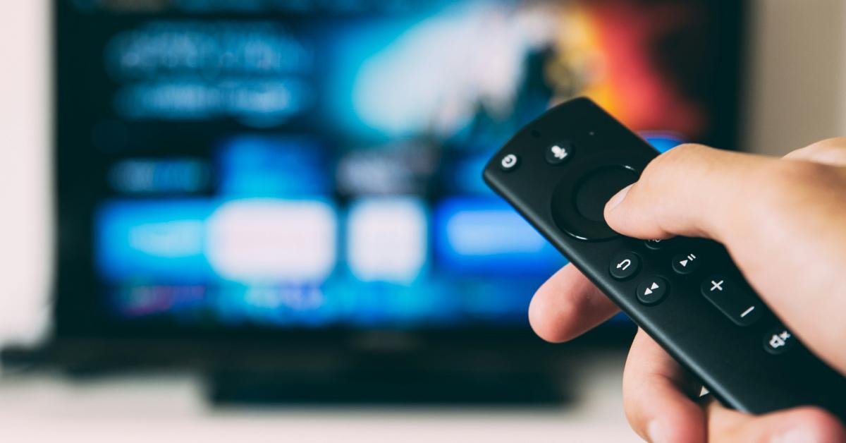 A person searching for a movie on their TV.