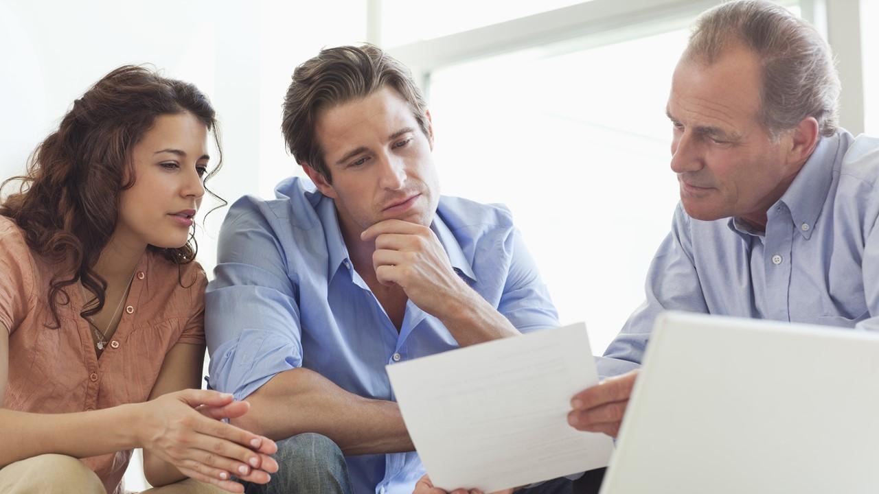 People looking at financial documents