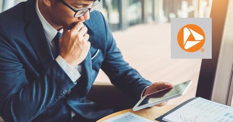 Man looking at a tablet and PNC Bank logo