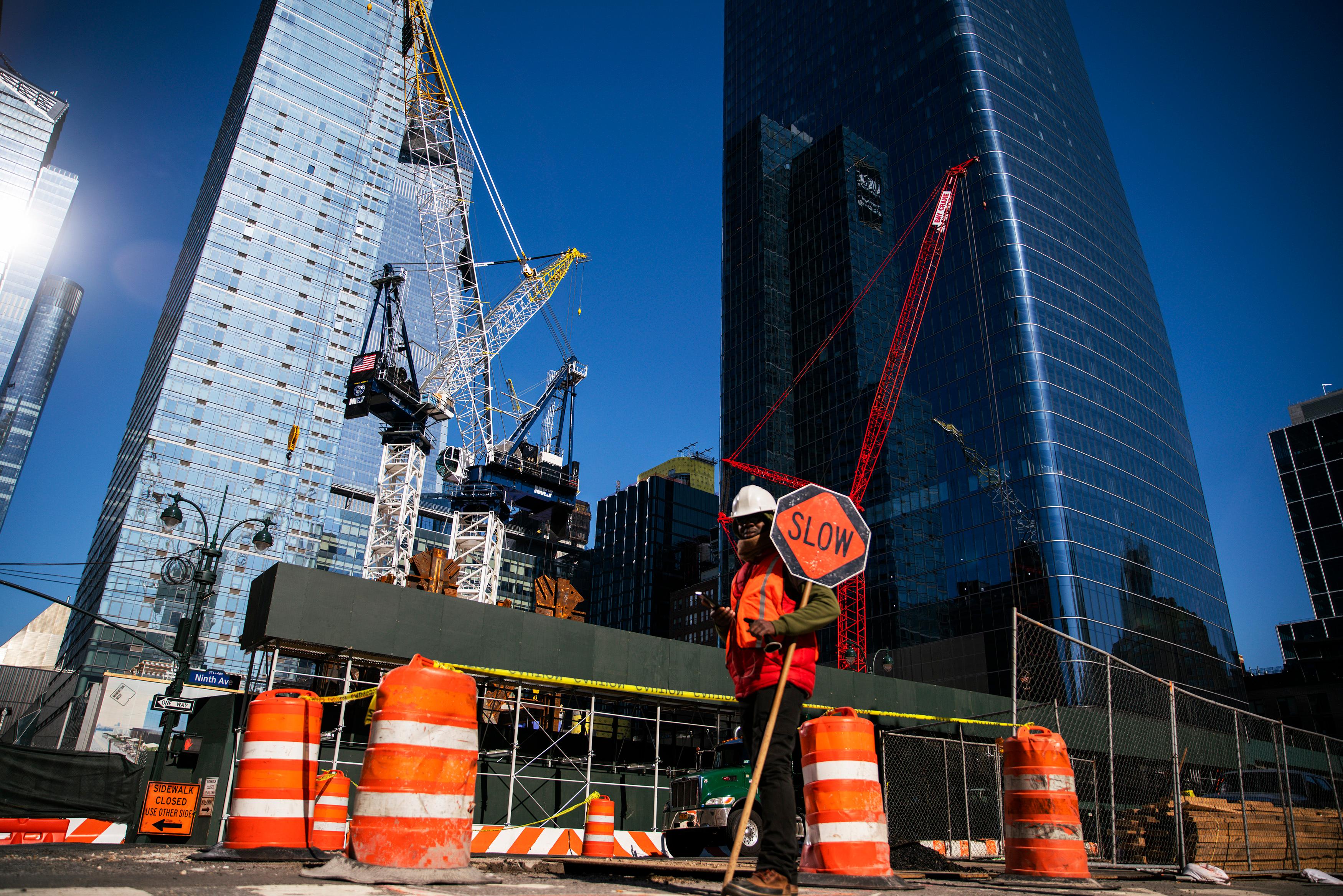 Road construction workers at work on improving infrastructure.