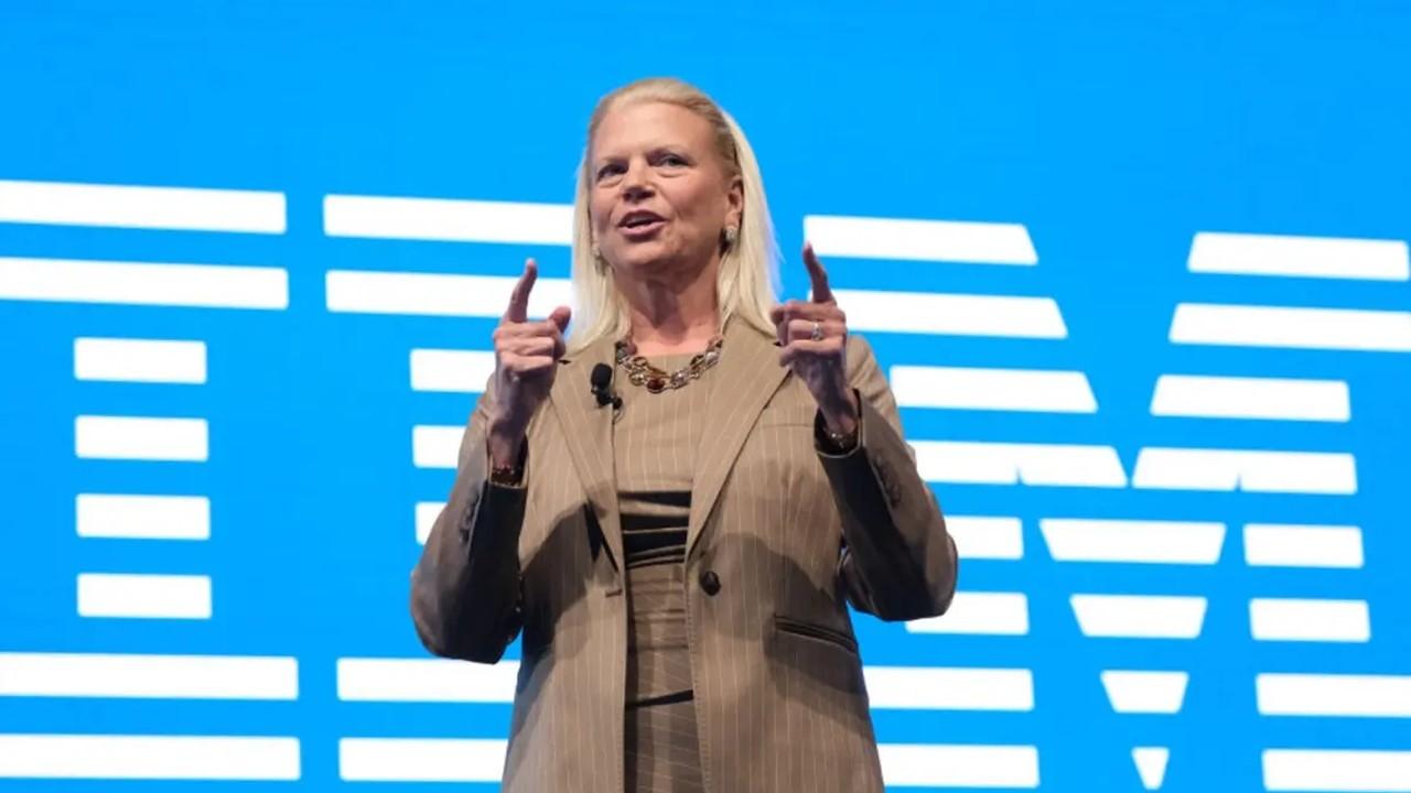 Ginni Rometty speaking in front of an IBM sign