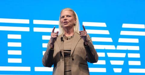 Ginni Rometty speaking in front of an IBM sign