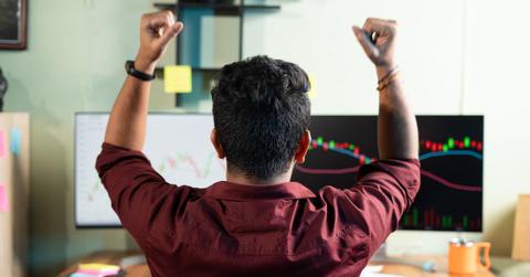 A man looking at crypto shorting data