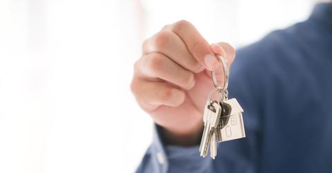 A man holding house keys