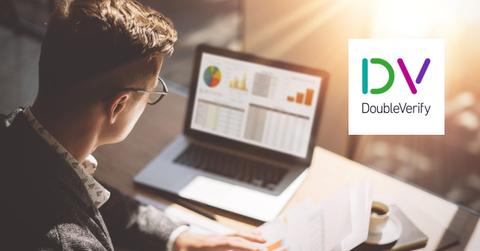 Man looking on a laptop and DoubleVerify logo