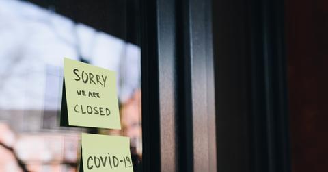 Business with a closed sign on the door due to COVID-19