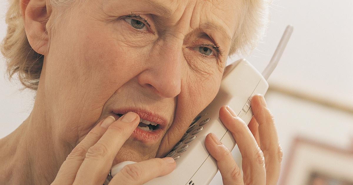 Worried elderly woman on the phone