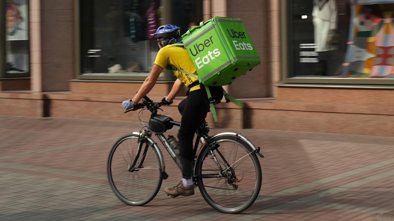 Uber Eats delivery worker on a bike