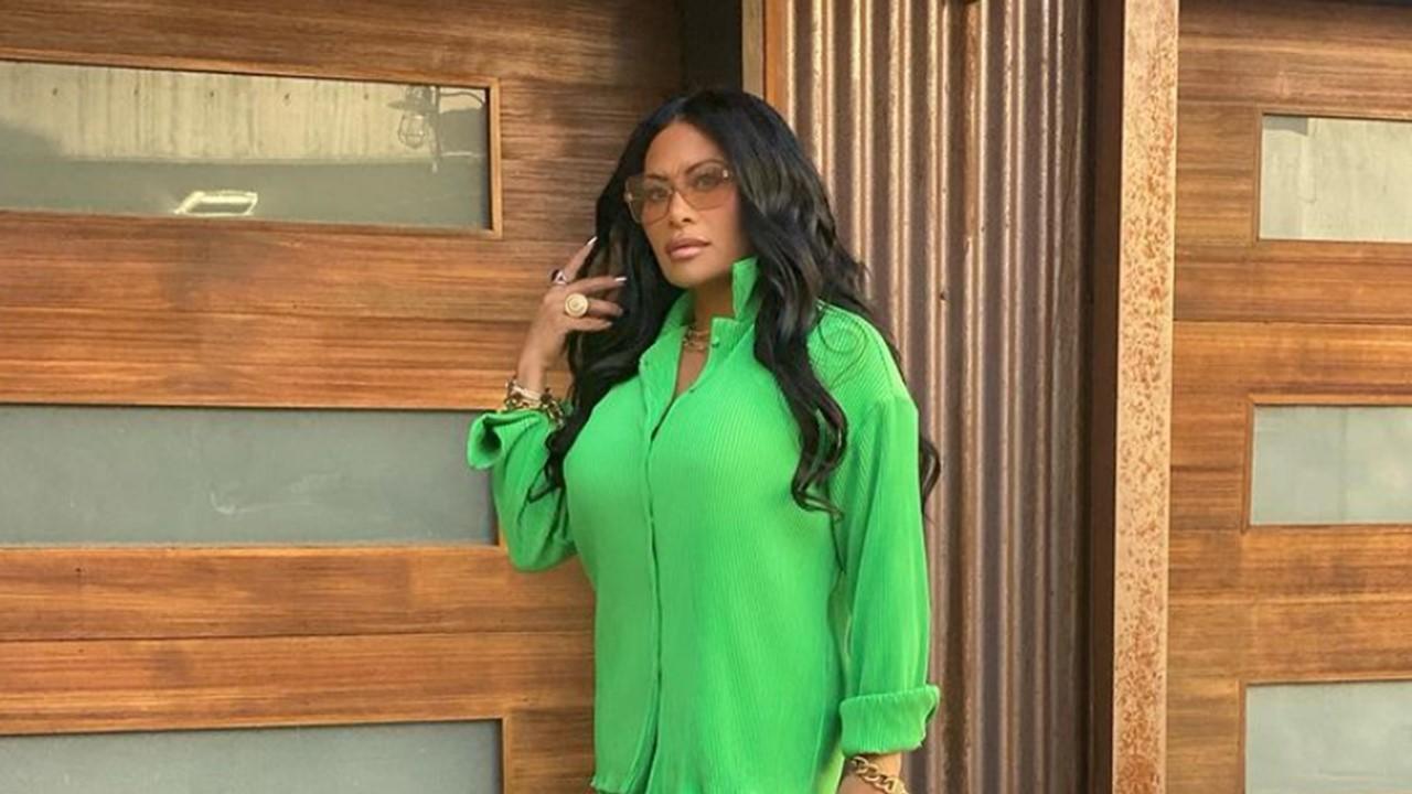 Jen Shah posing in green outfit